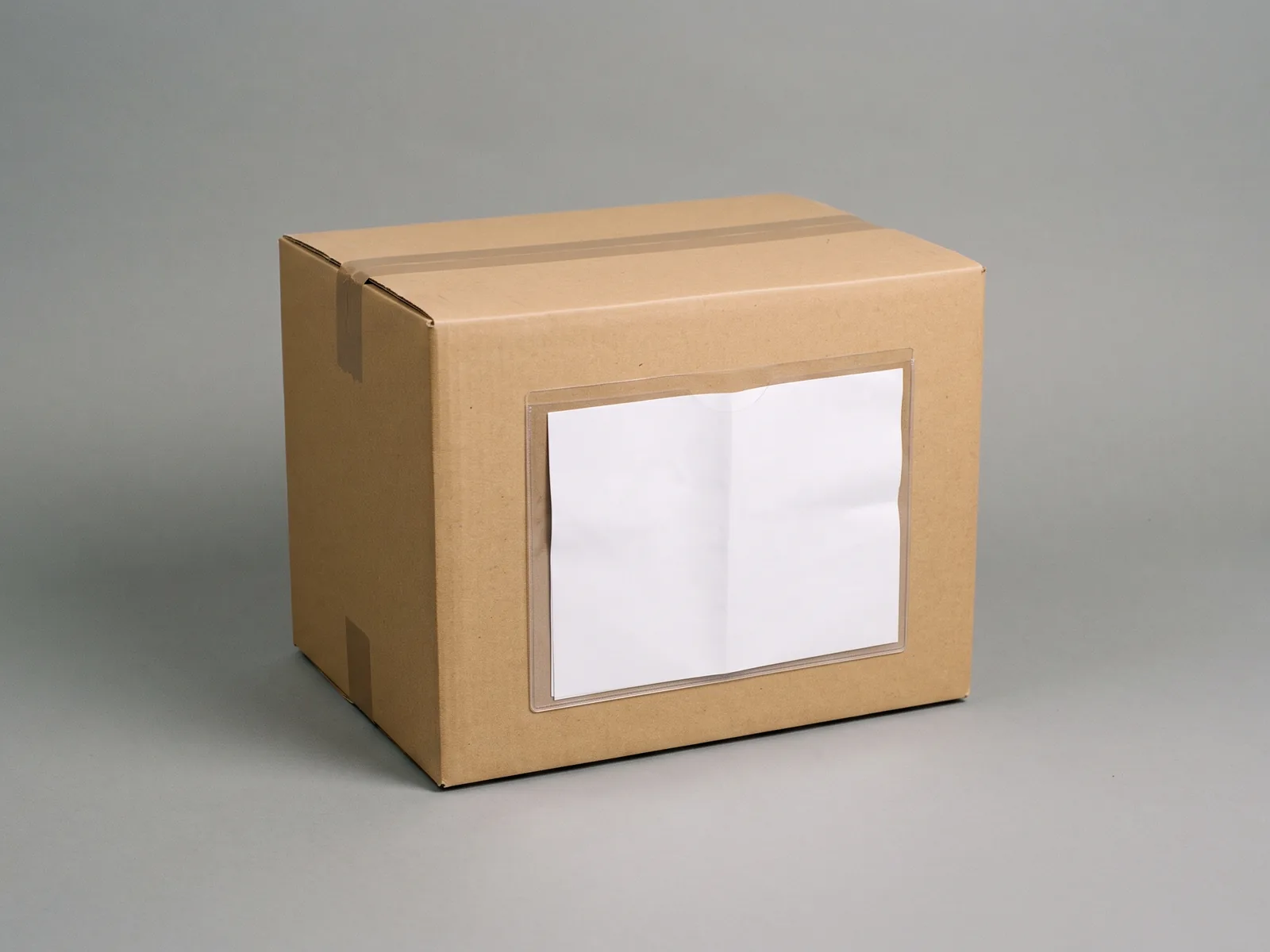 A sealed export carton with a filled document wallet attached to its side