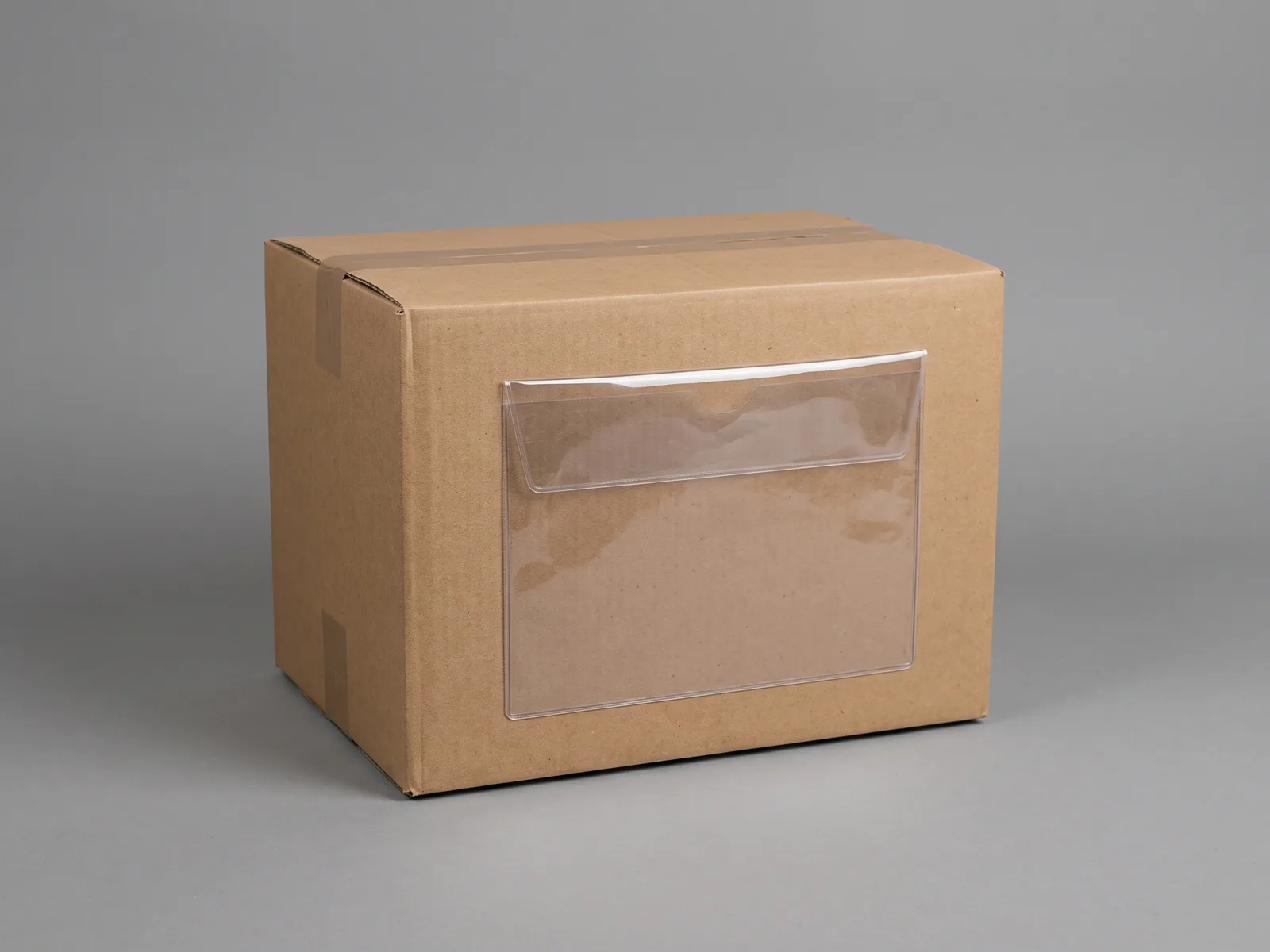 An identical sealed export carton with an empty document wallet attached to its side