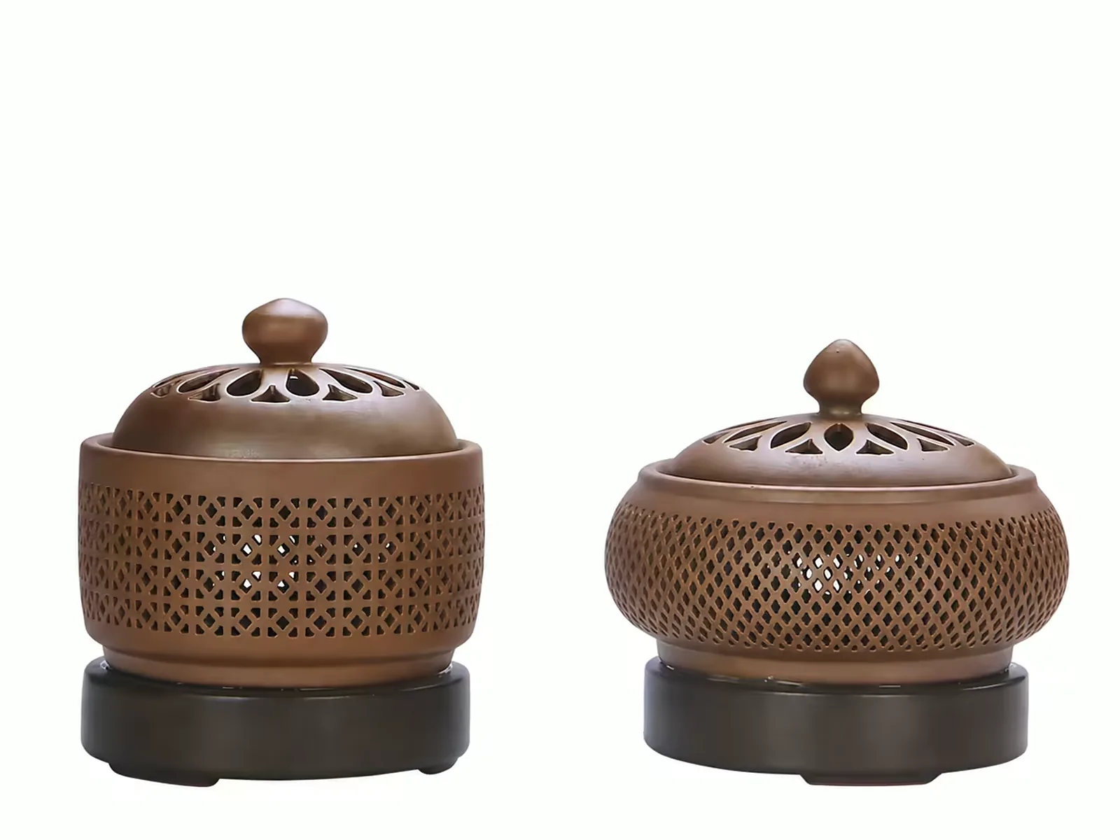 Two ceramic koro censers with pierced lids and footed bases, side by side