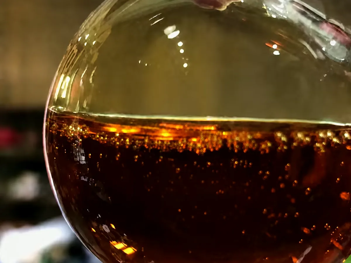Agarwood essential oil — close-up detail, oud oil wholesale