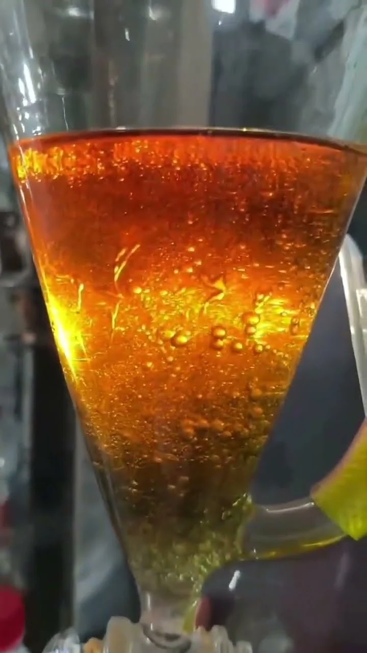 Oudh oil separating from the water layer during a traditional distillation run