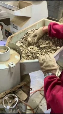 Agarwood chips being milled into graded powder